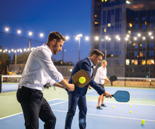 Corporate team playing pickleball