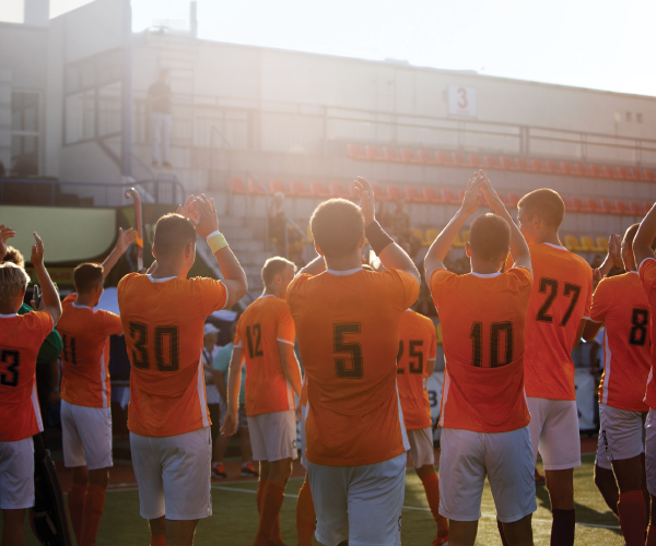 People socializing at a pickleball event